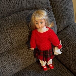 Adorable China, doll, dressed in red sweater, plaid skirt, bloomers,  red shoes